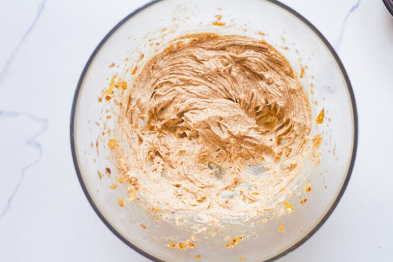 creamed butter, sugar, and spices in a clear bowl