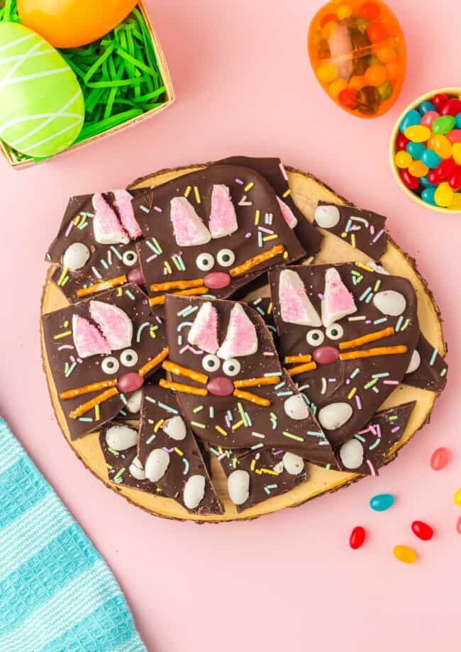 pieces of easter bunny chocolate bark on a wood board