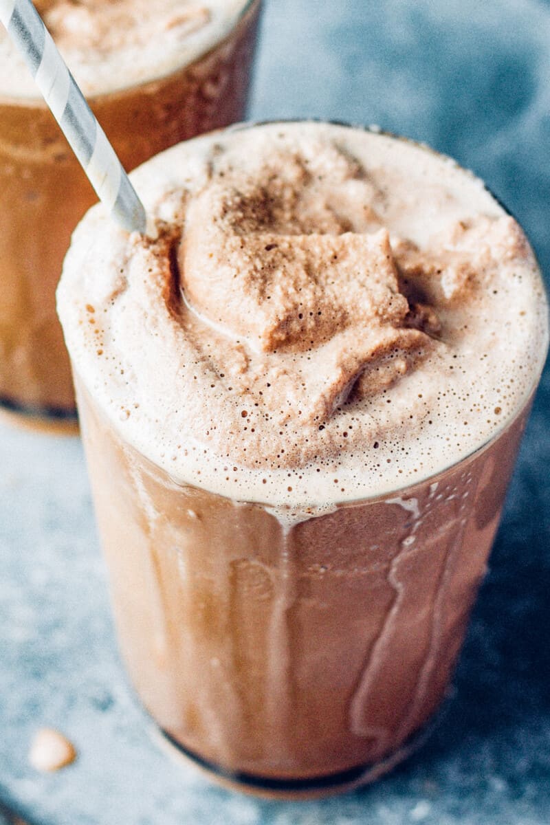 chocolate frosty in a glass with a straw
