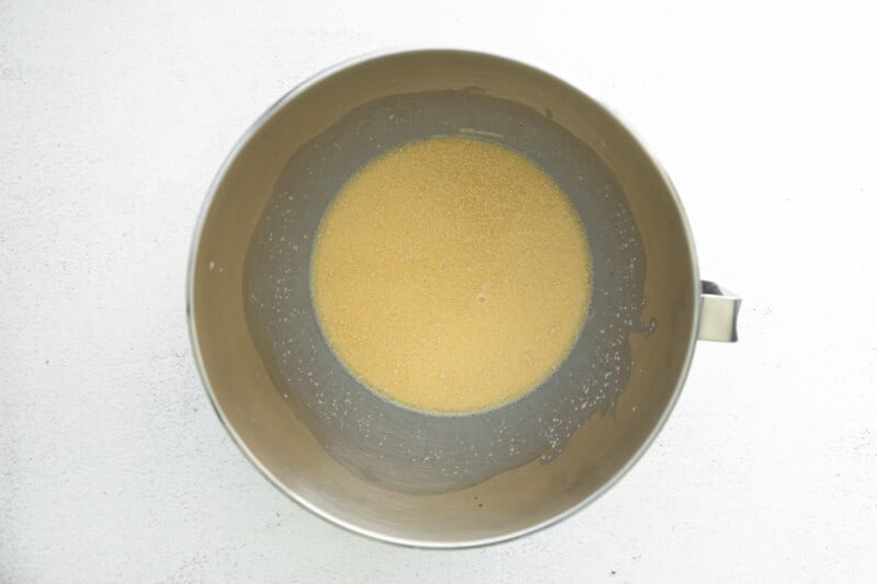 yeast and milk in a metal bowl