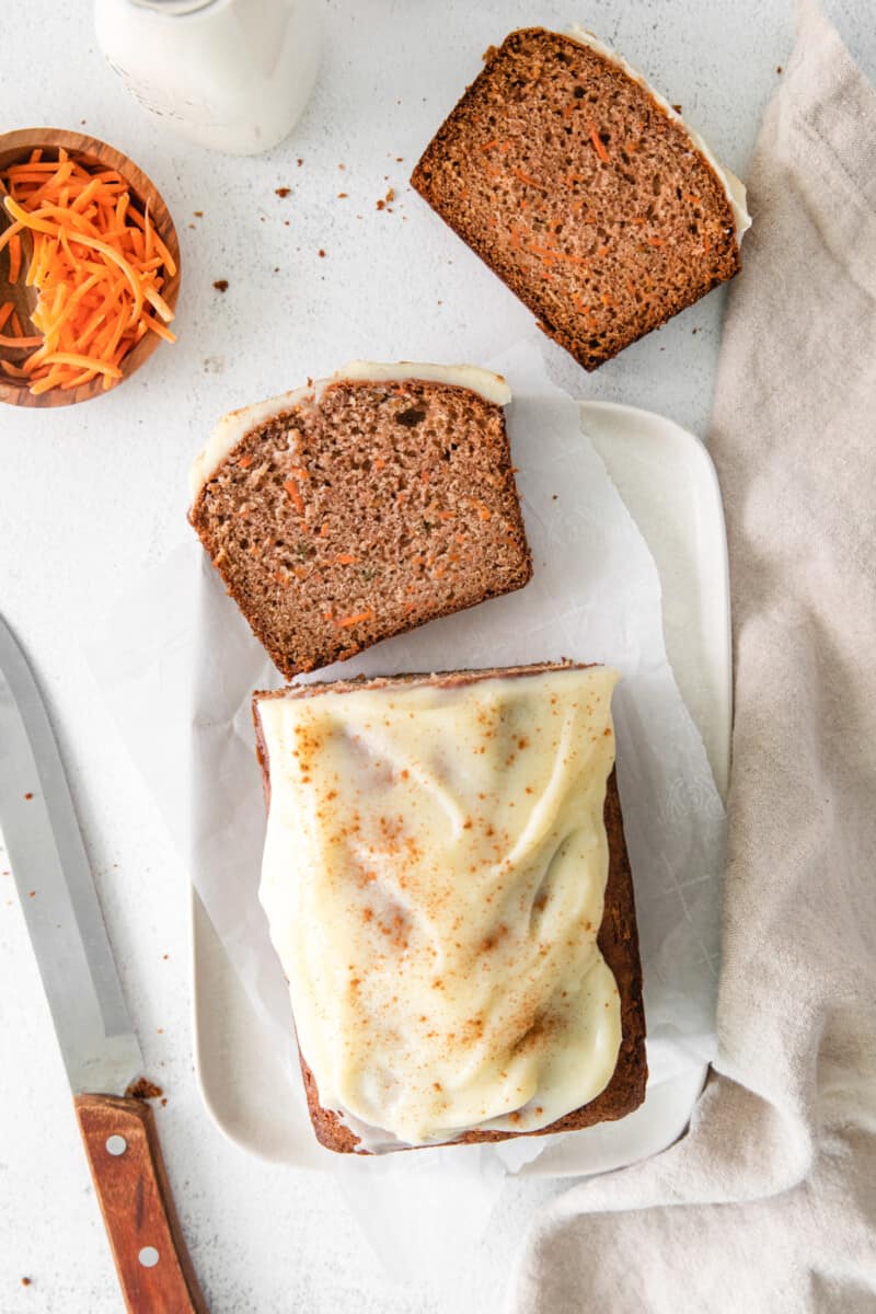 overhead image of carrot bread topped with cream cheese glaze