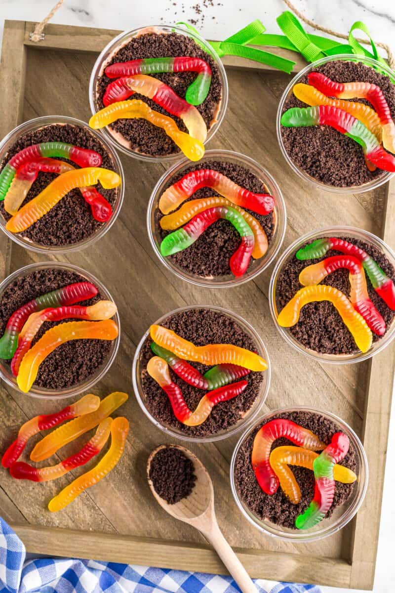 overhead image of dirt cake cups with gummy worms