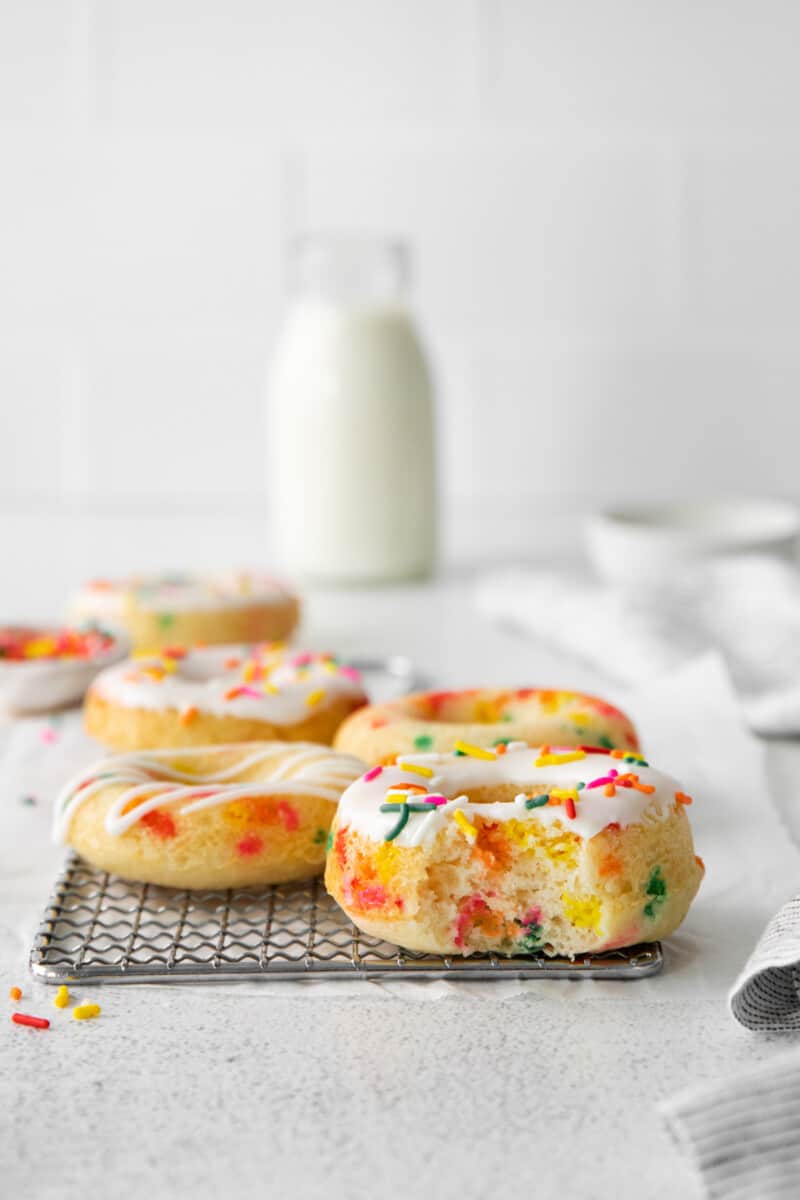 funfetti donuts with a bite taken from one