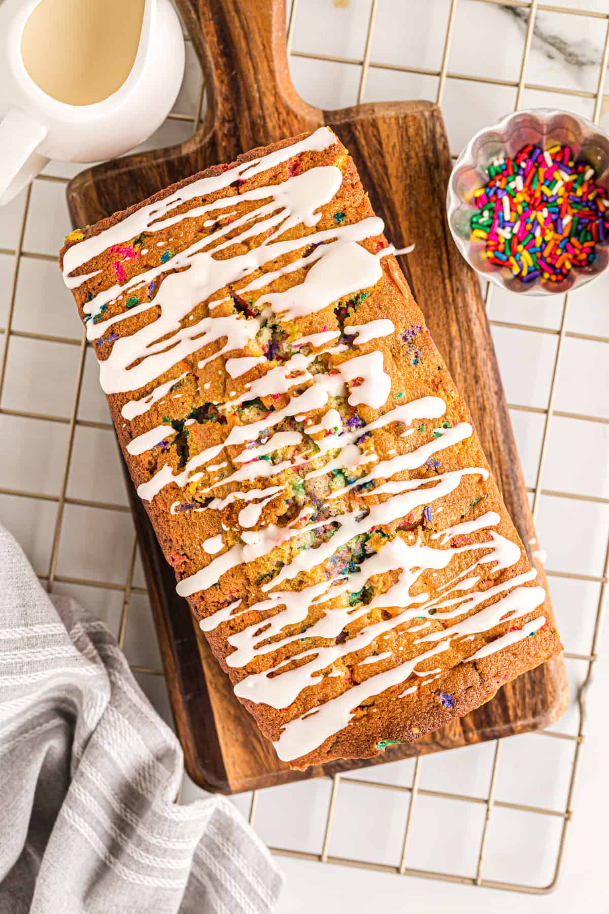 overhead image of funfetti pound cake with glaze drizzled on top