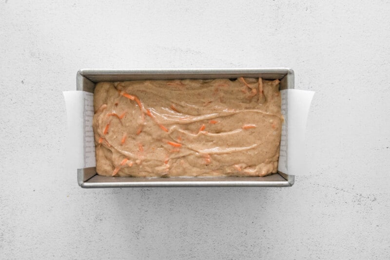 carrot bread in a loaf pan before baking