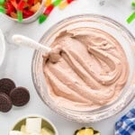 chocolate pudding cream cheese mixture in a glass bowl with a spatula