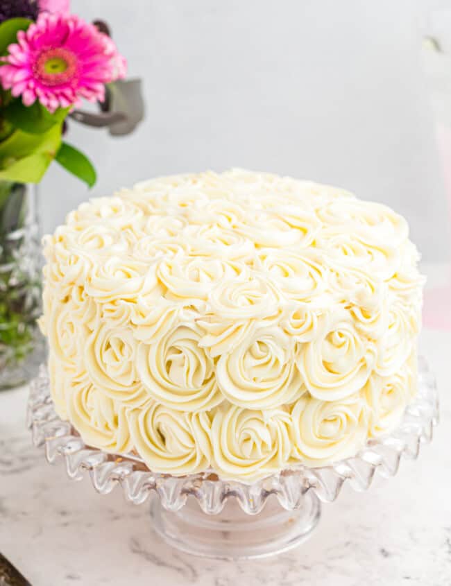 easy homemade wedding cake on a glass cake stand.