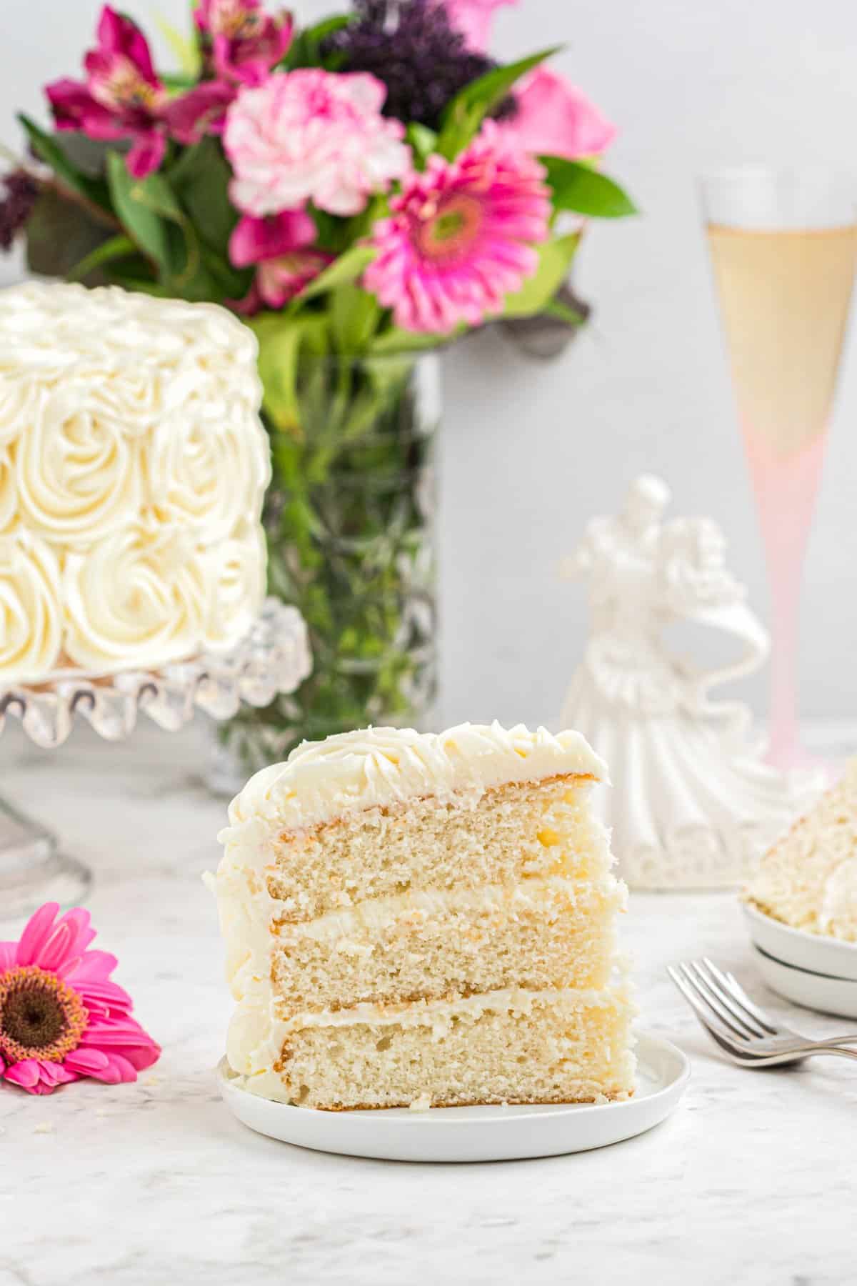 a slice of easy homemade wedding cake on a white plate.