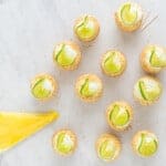 key lime cupcakes garnished with lime slices.