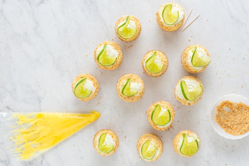 key lime cupcakes garnished with lime slices.