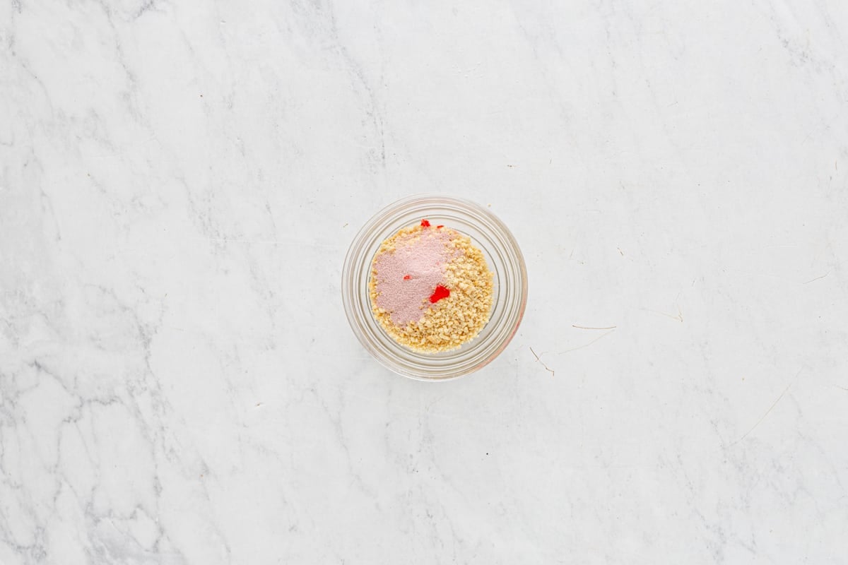 overhead view of strawberry shortcake cupcake topping in a glass bowl.