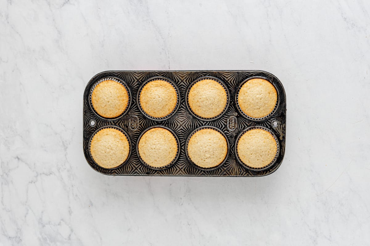 baked strawberry shortcake cupcakes in an 8 cupcake tin.