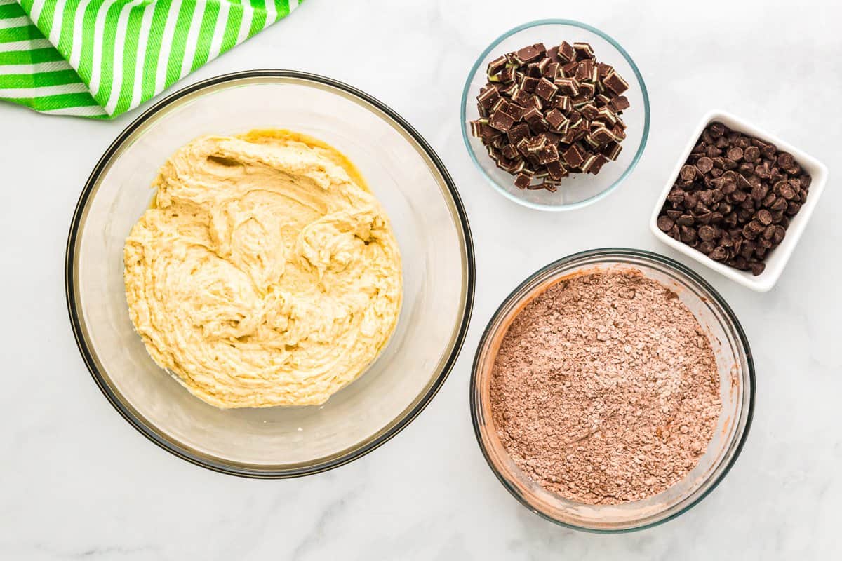 creamed wet ingredients for andes mint cookies in a glass bowl.