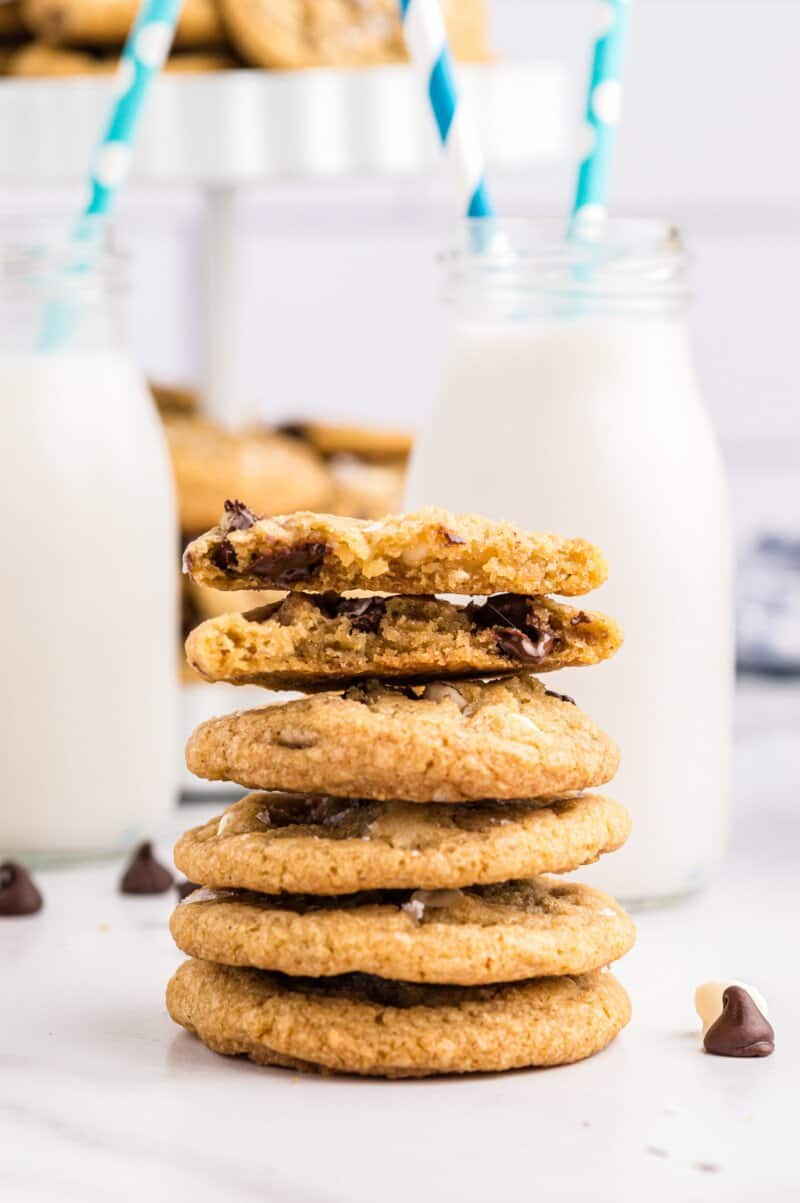 halved brown butter chocolate chip cookie on a stack of 4 cookies.