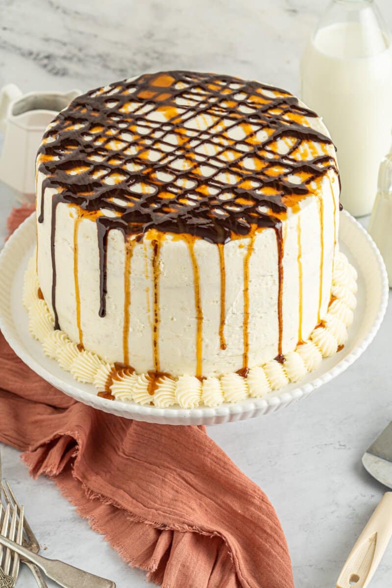 chocolate caramel ombre cake on a white cake stand.