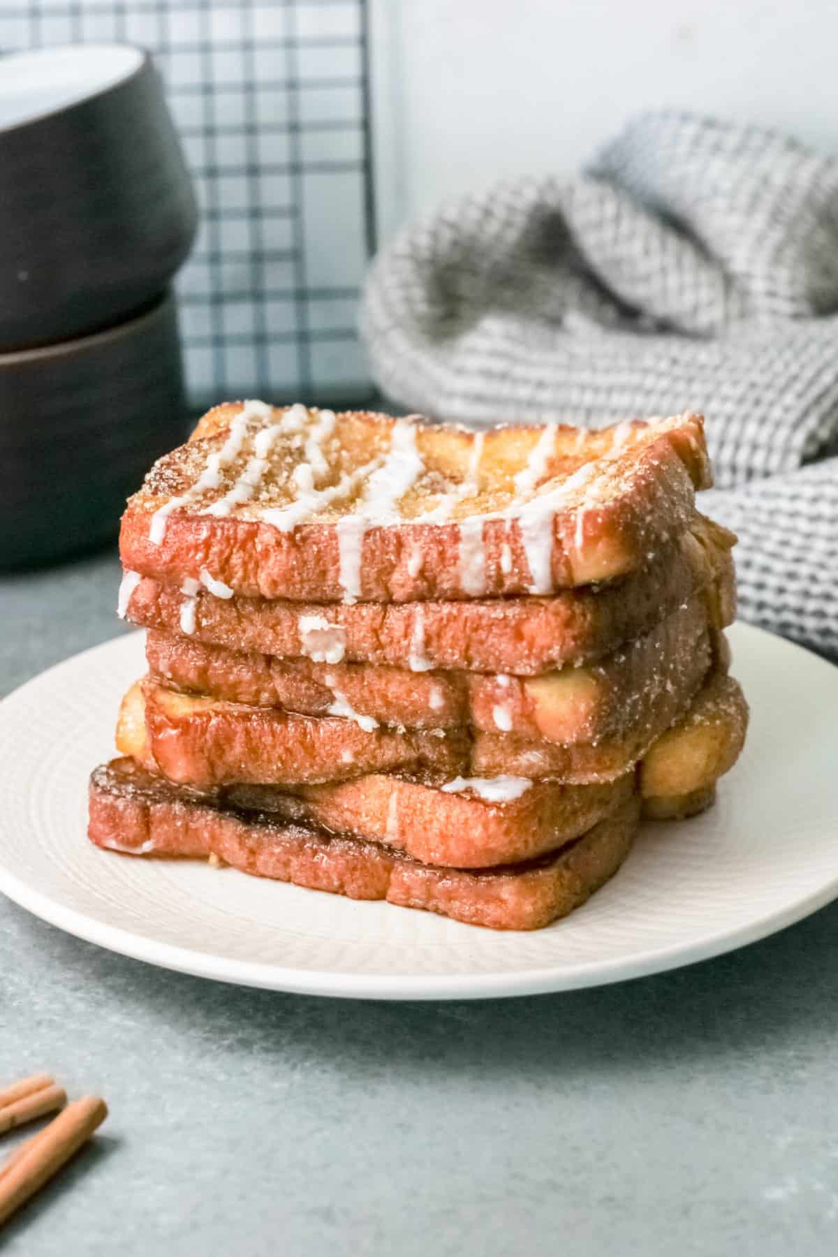 6 stacked slices of churro french toast.