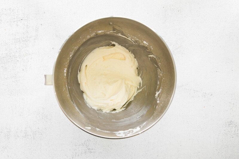 chai tea cupcake frosting in a stainless mixing bowl.