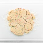 rolled out funfetti shortbread cookie dough cut in circles.