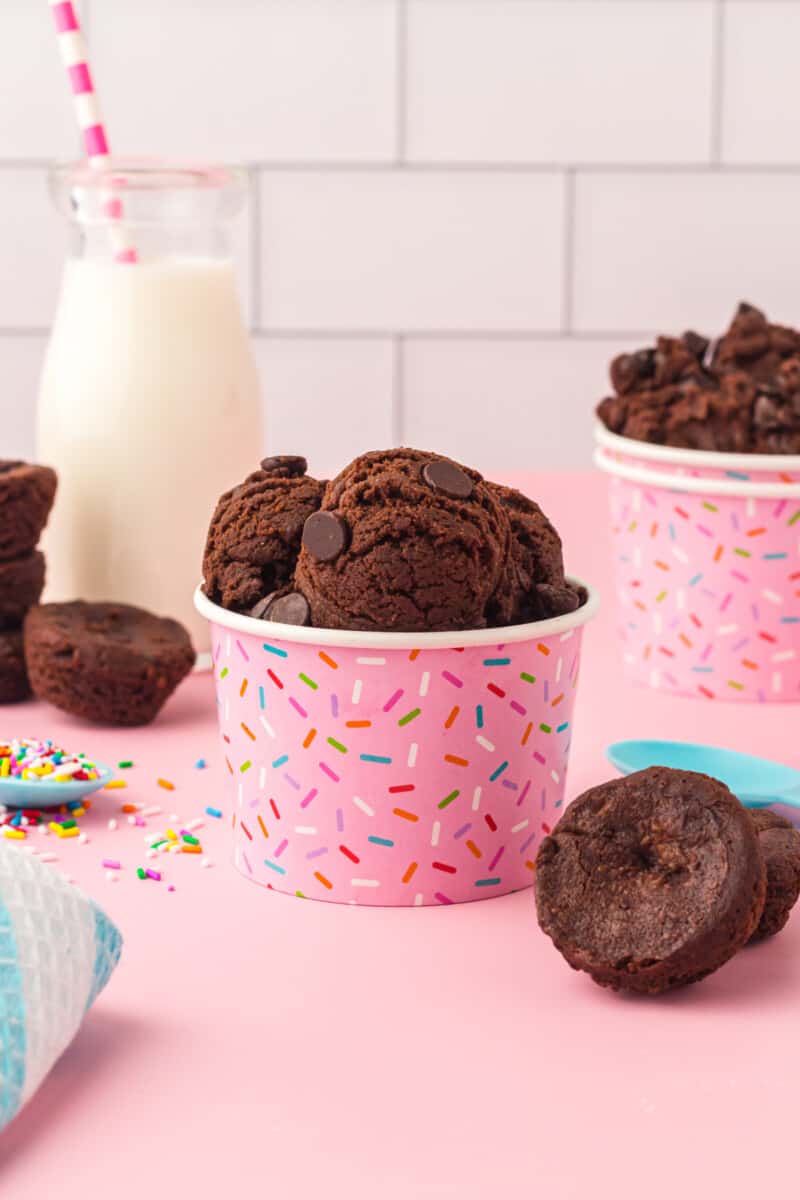 profile view of edible brownie batter in a pink sprinkle cup.