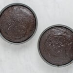 overhead view of baked german chocolate cake layers in round cake pans.