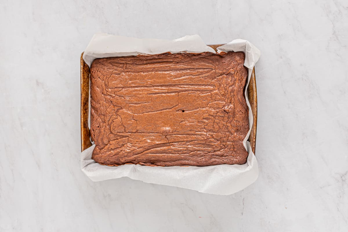 overhead view of baked peppermint brownies in a baking pan.