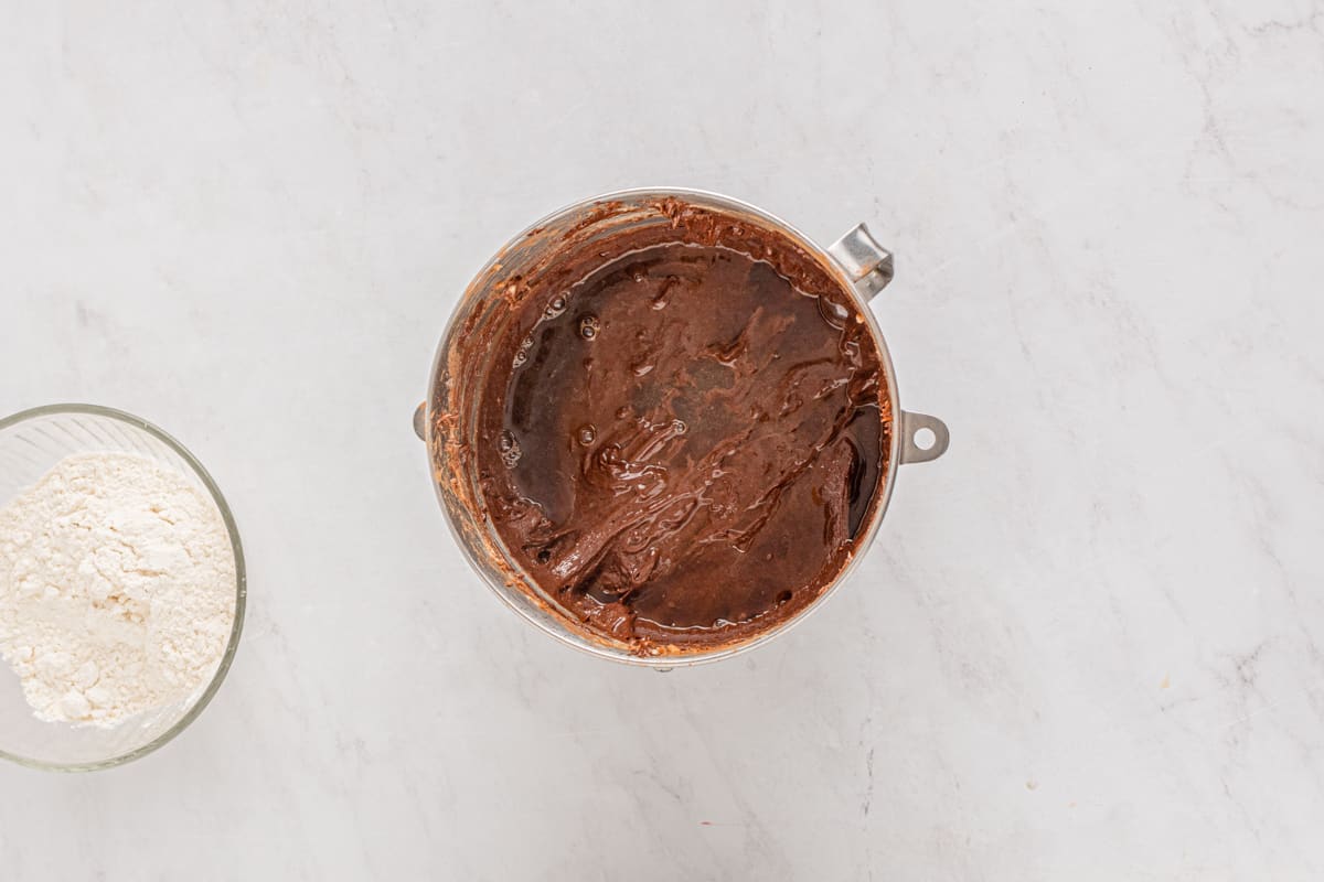 overhead view of peppermint brownie batter in a stainless mixing bowl.