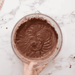 chocolate cupcake batter in a glass bowl.