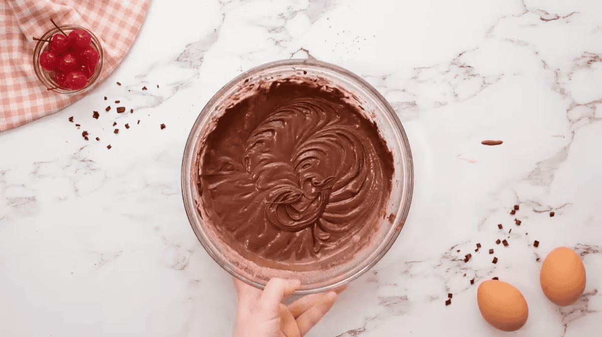 chocolate cupcake batter in a glass bowl.