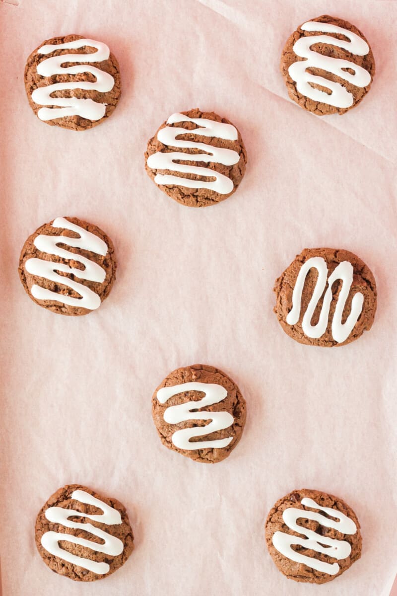 close up of 8 hot cocoa cookies on parchment paper.
