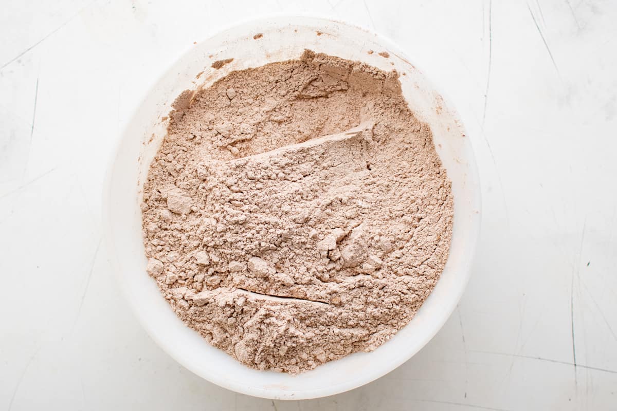 overhead view of homemade hot chocolate mix in a white bowl.