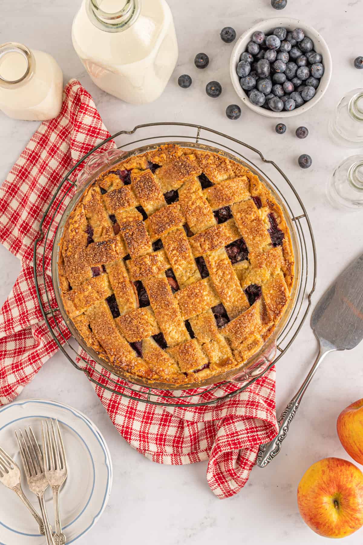 overhead view of an apple blueberry pie with lattice top pie crust
