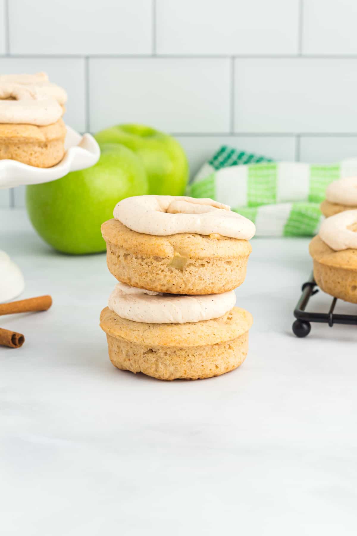 apple cinnamon donuts stacked on top of each other