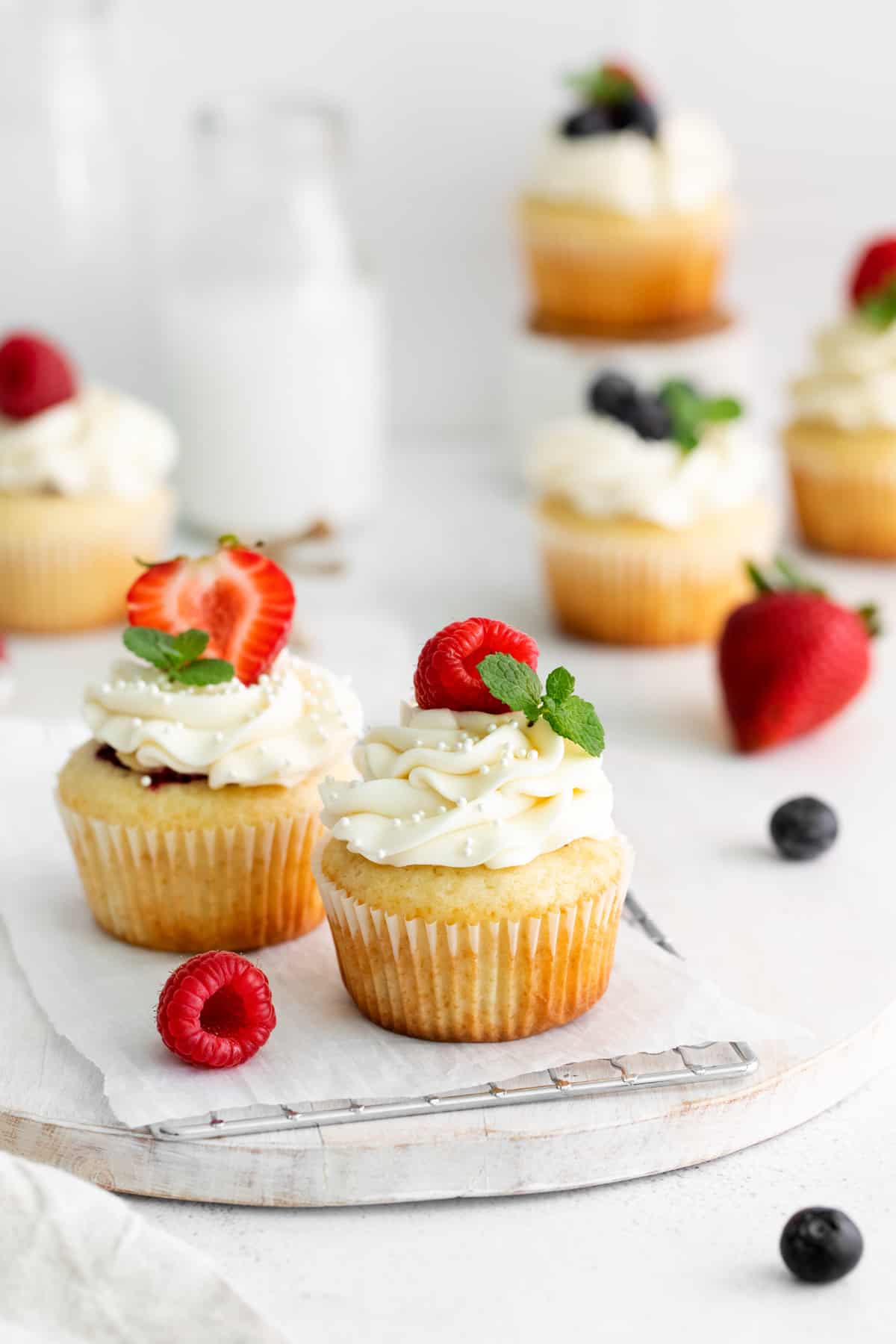 mascarpone berry cupcakes topped with fresh berries