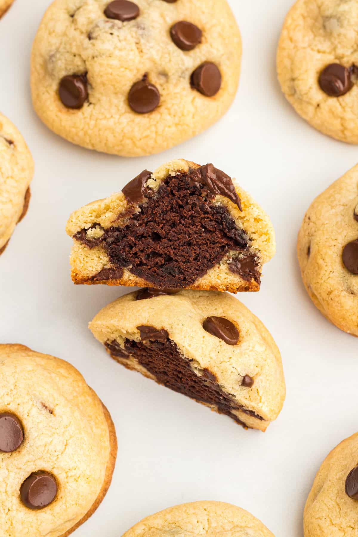 chocolate chip cookie cut in half to reveal a brownie at the center