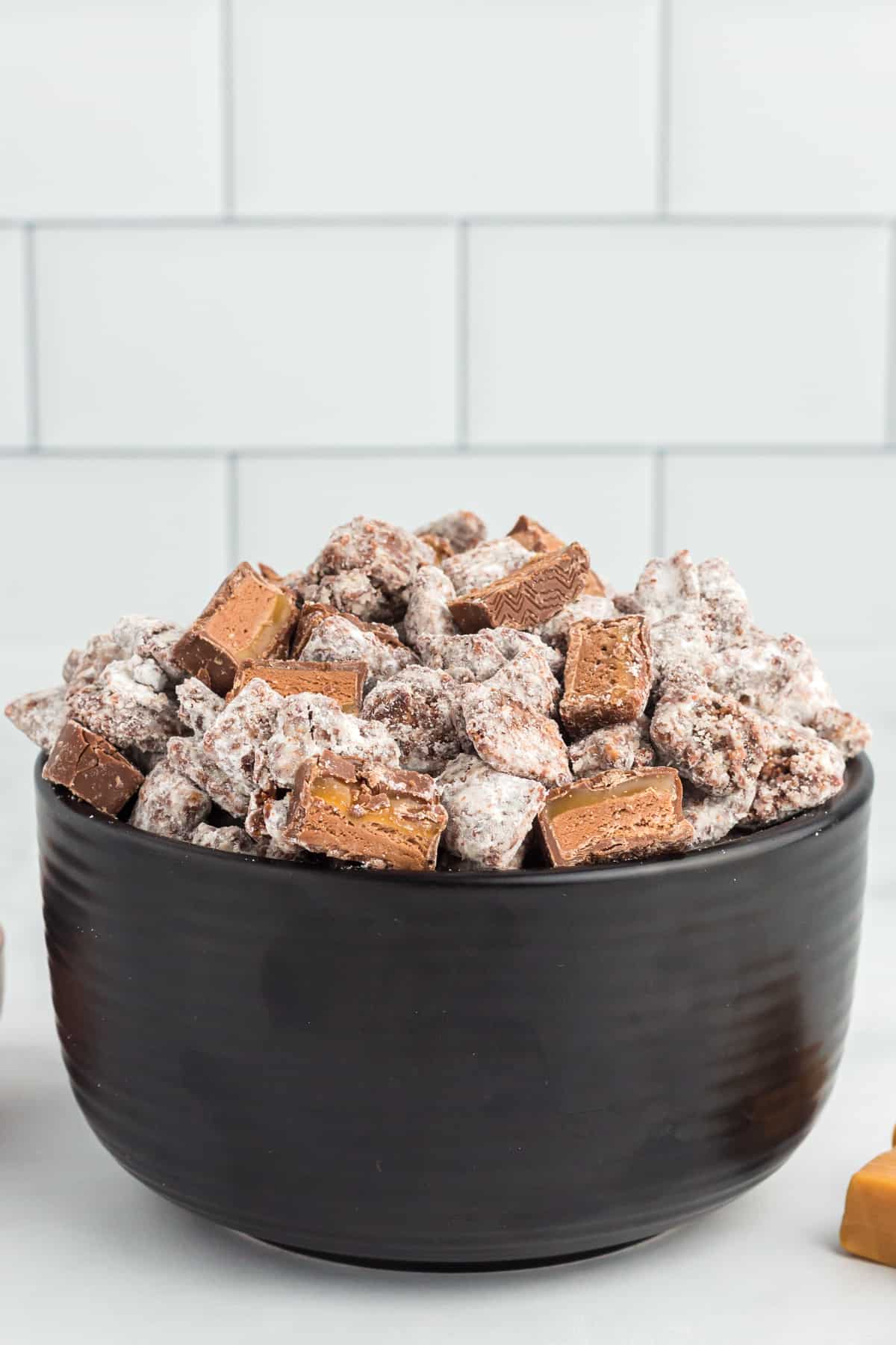 close up on a bowl filled with chocolate puppy chow