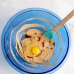 combining wet ingredients in a mixing bowl