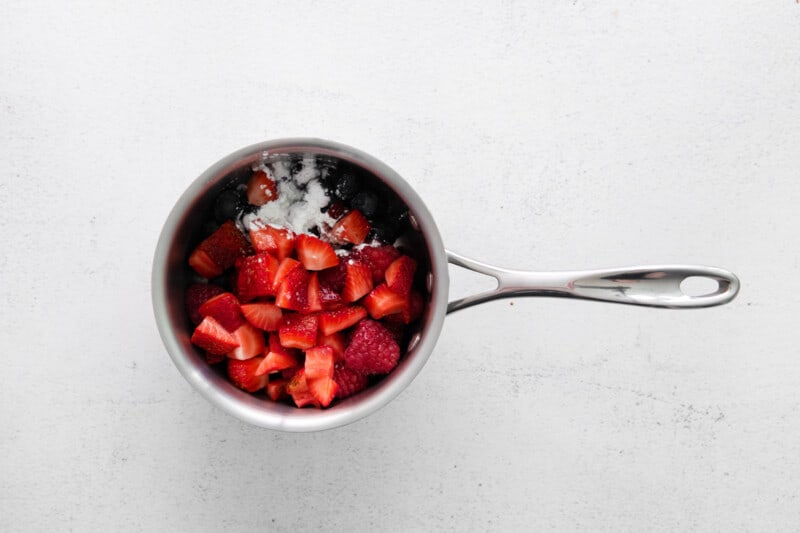 berries and sugar in a pot