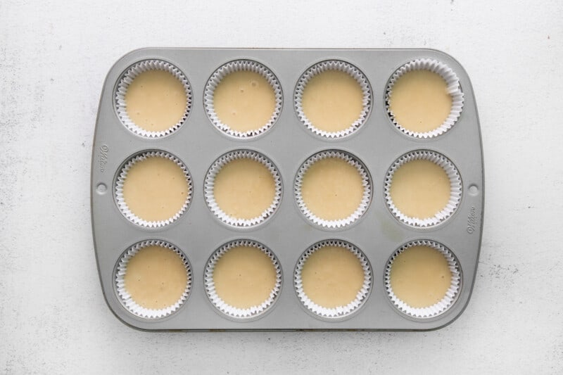 cupcake tin filled with batter, uncooked