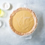 butterscotch pie with a piece of wax paper over the top
