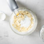 mixing buttermilk into the cake batter