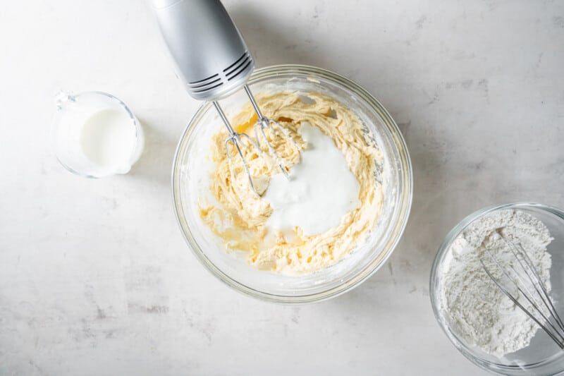 mixing buttermilk into the cake batter