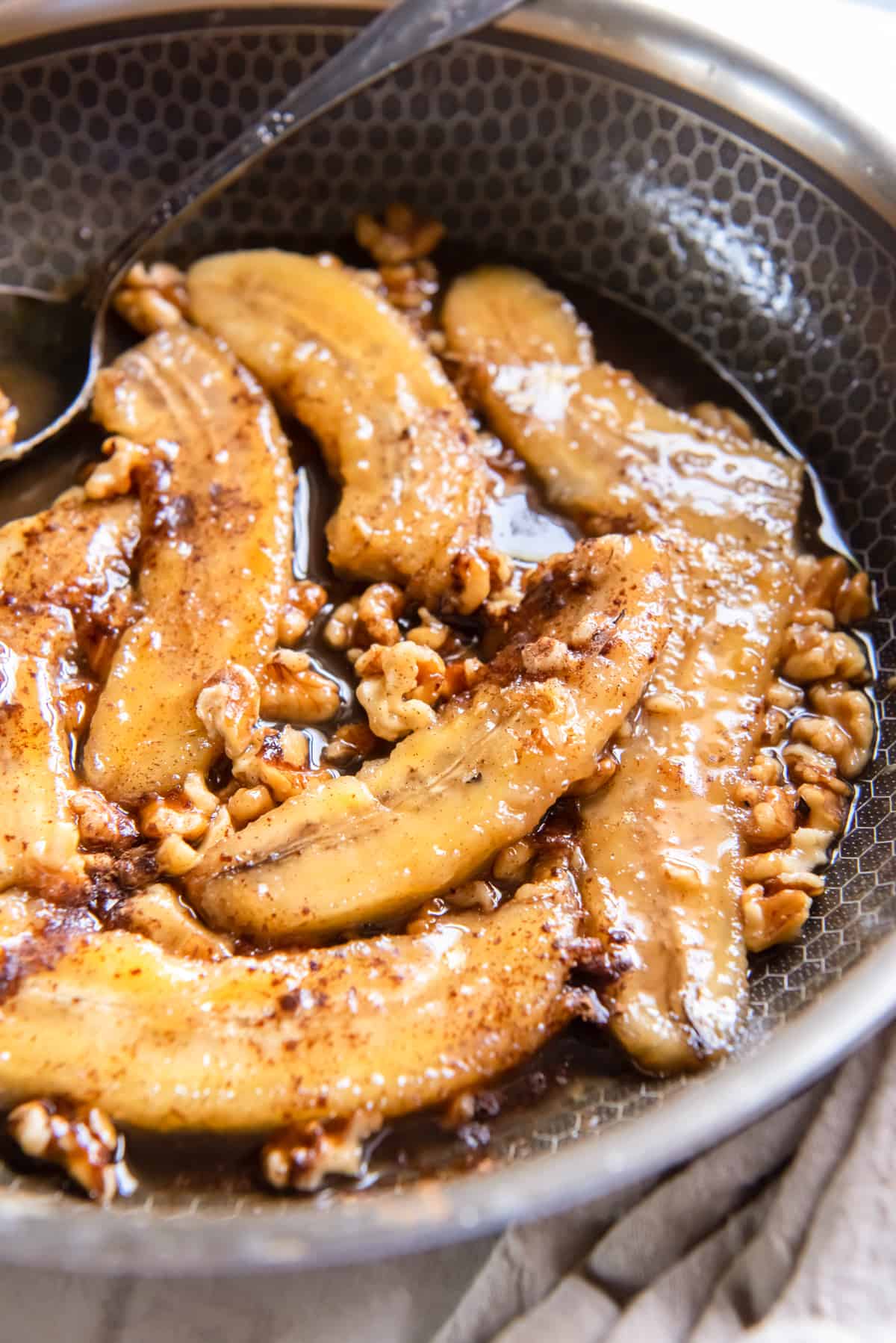 cooked bananas and pecans in a brown butter sauce