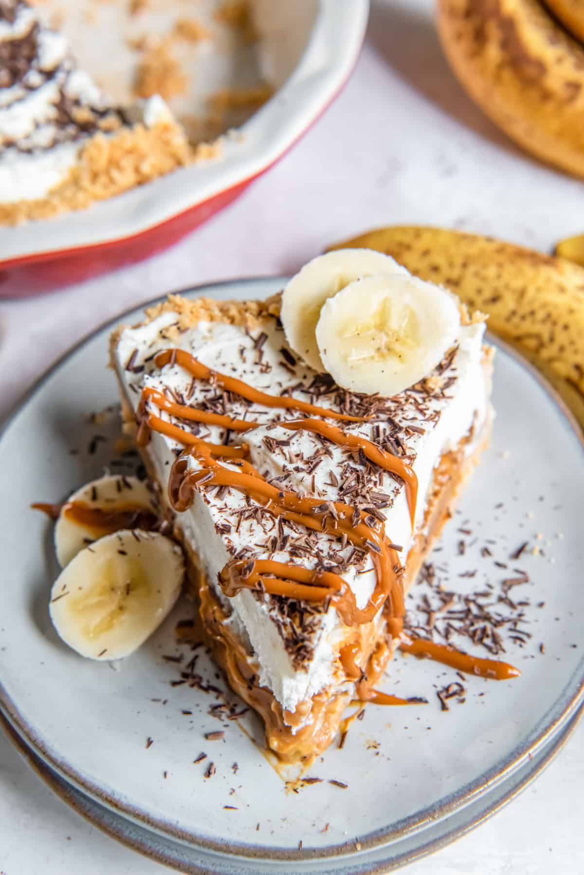 a slice of banoffee pie garnished with banana slices
