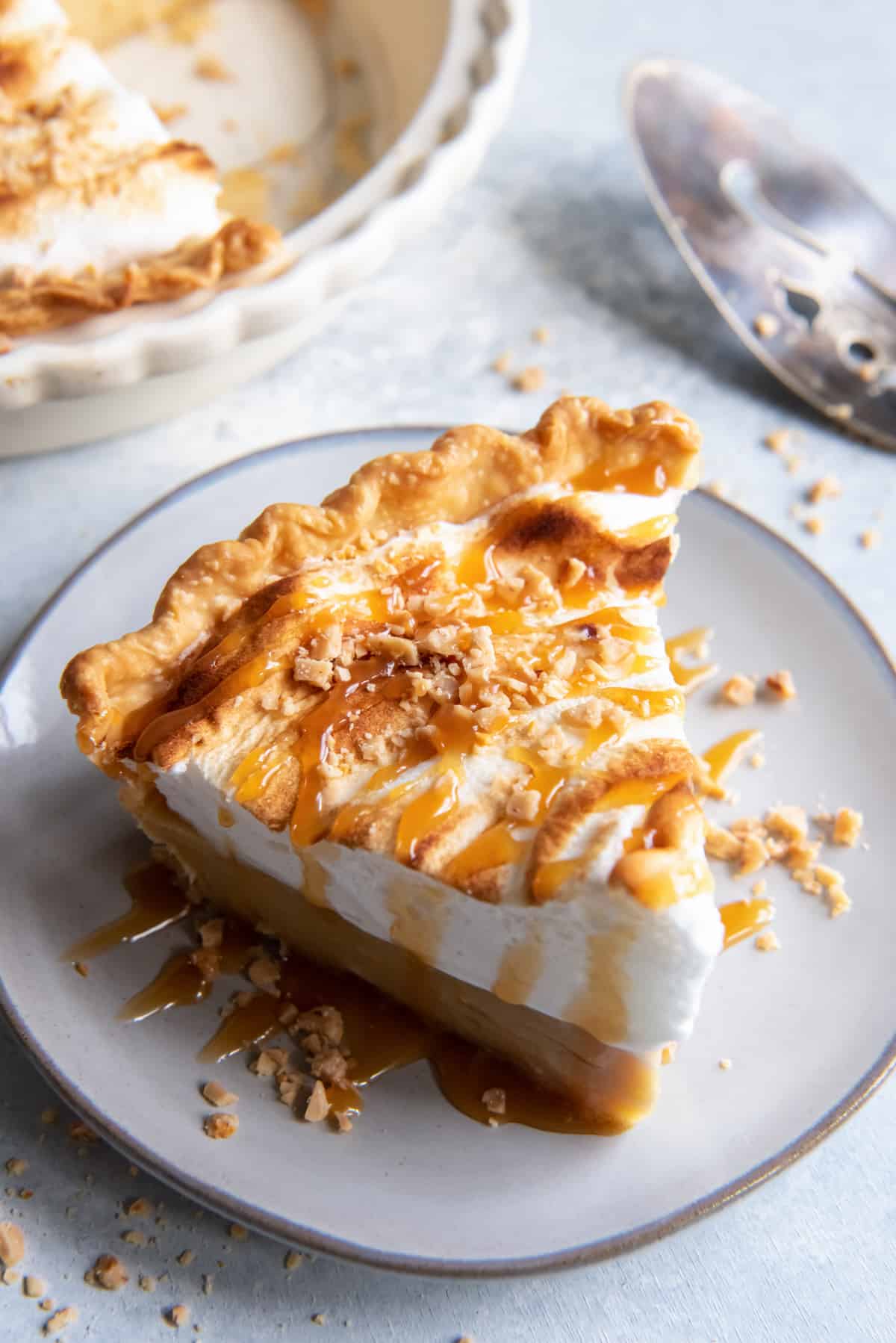 butterscotch pie with meringue topping and caramel sauce