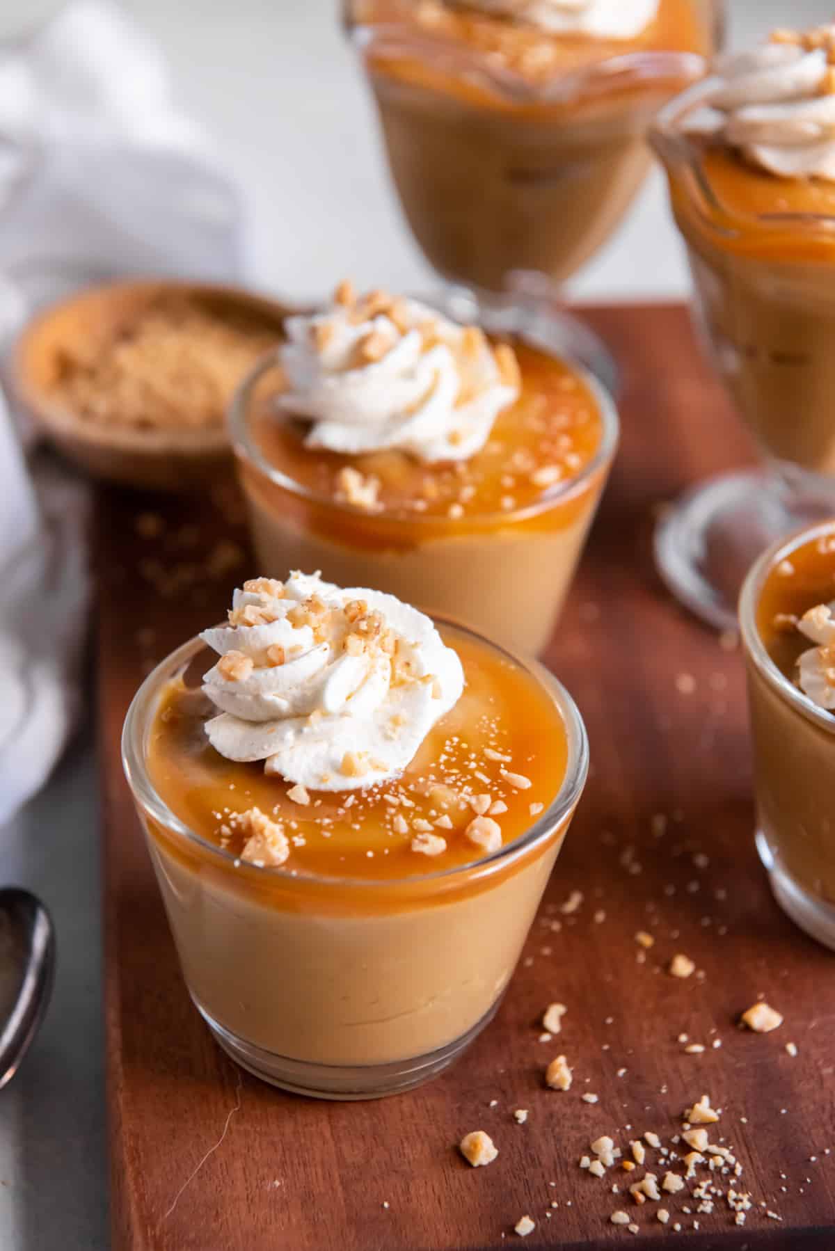 butterscothch pudding in various glass cups