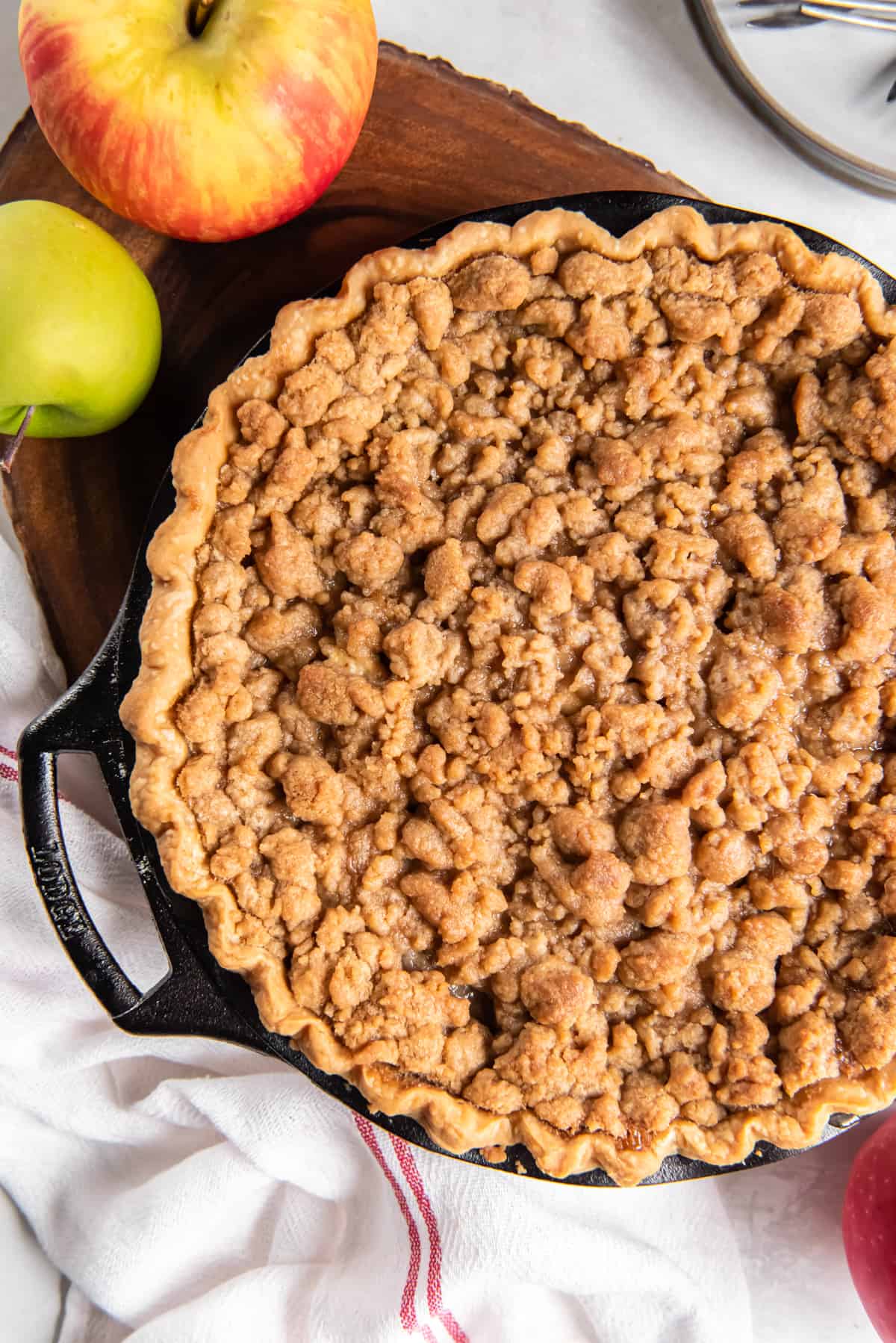 overhead view of a caramel apple pie with crumble topping