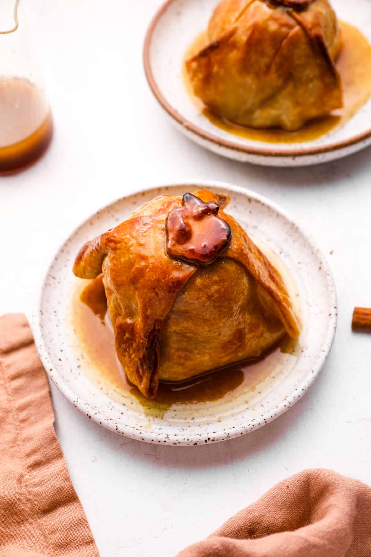 apple dumplings on white plates.