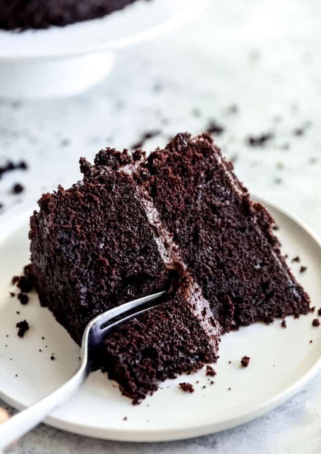 fork cutting into a piece of blackout chocolate cake
