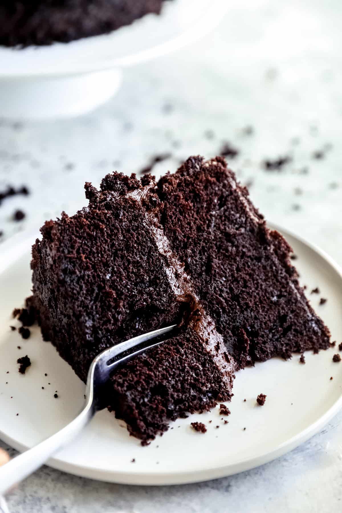 fork cutting into a piece of blackout chocolate cake