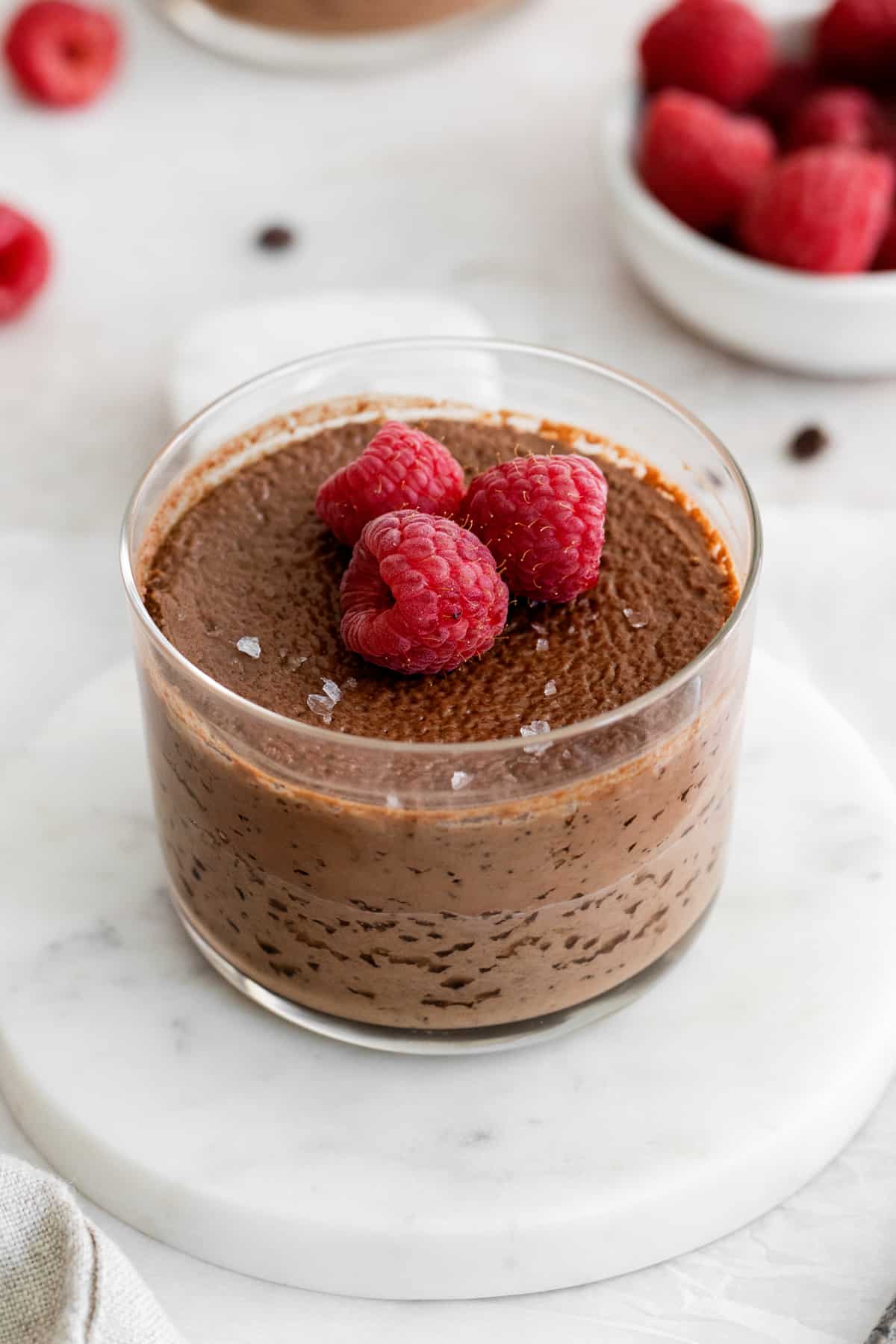 chocolate pot de creme topped with raspberries